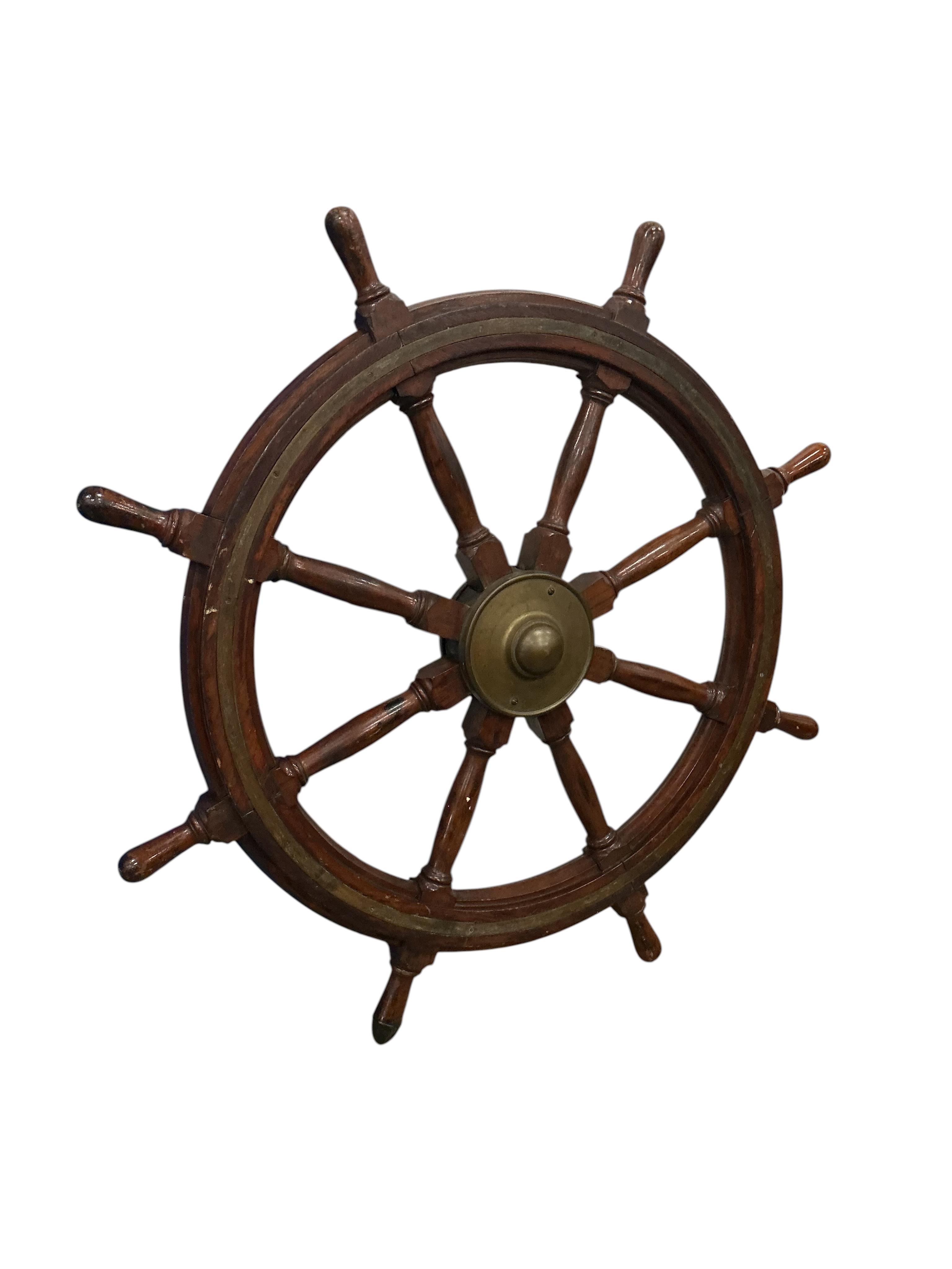 An early 20th century brass mounted teak ships wheel, diameter 114cm